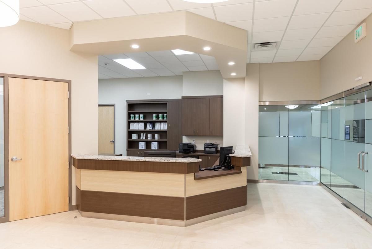 City Creek Dental reception desk in maple and granite
